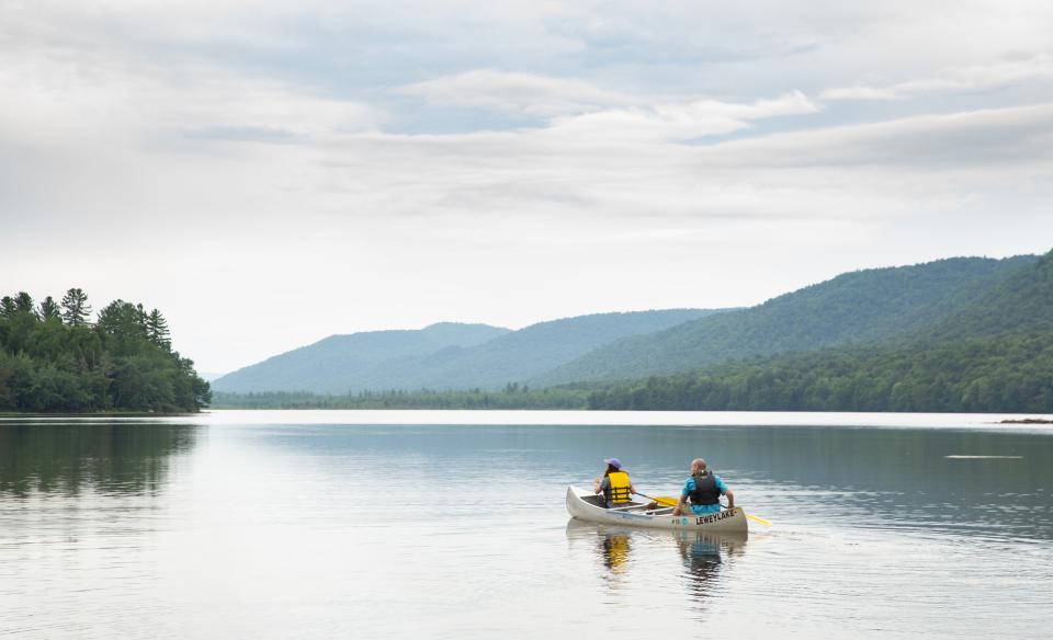 People rowing a canoe on Lewey Lake