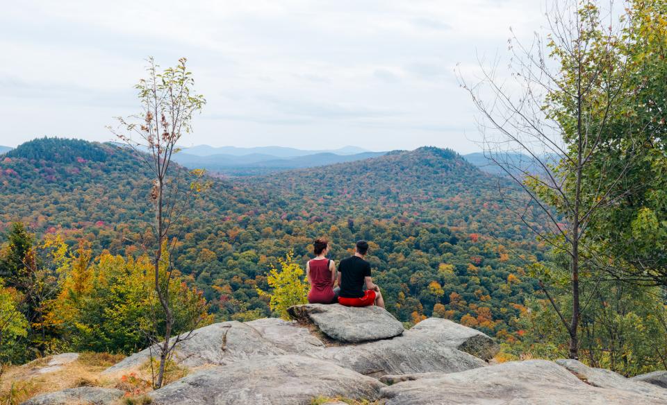 Two hikers at a scenic overlook