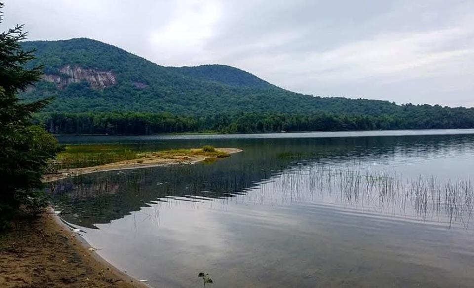 Tirrell Pond with the cliffs of Tirrell Pond Mountain in the background