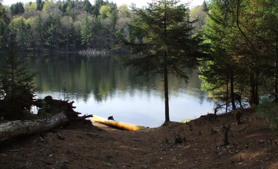 The tranquil waters of Little Tupper Lake beckon the paddler